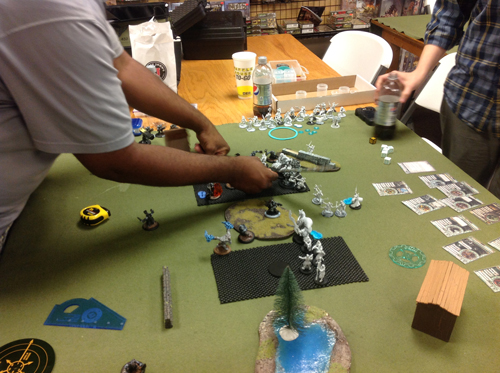a game of hordes during the visit. they were also running a tcg tournament